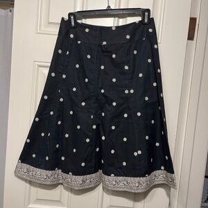 Black skirt with cream flowers and border